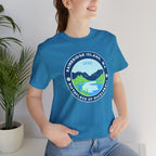 Unisex Bainbridge Island Pickleball T-Shirt featuring "Birthplace of Pickleball 1965" logo on white fabric.