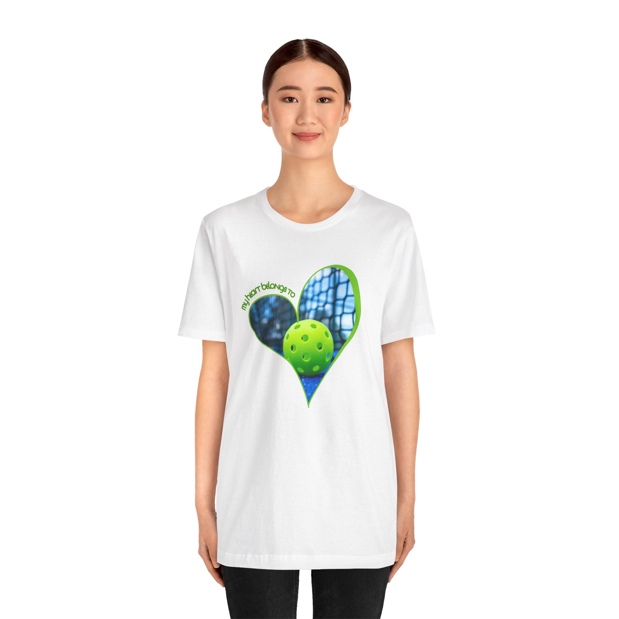 White pickleball T-shirt by Printify featuring the phrase "My Heart Belongs to Pickleball" for players and fans.