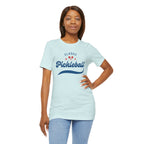 Red and blue pickleball T-shirt with script design featuring paddles and a ball, from Printify.