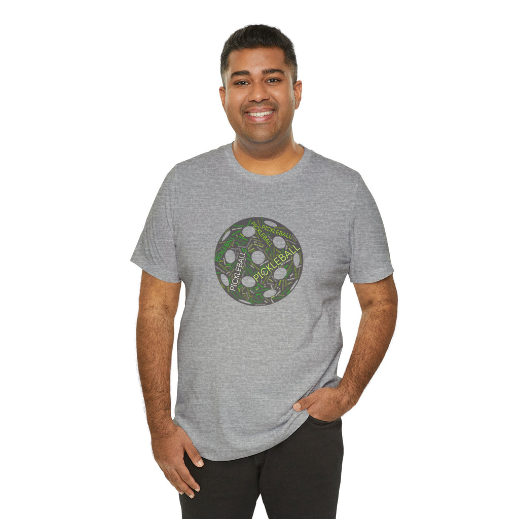 Graphic T-shirt featuring a pickleball word cloud with words like Dink, Pickle, and Kitchen on a cotton tee.