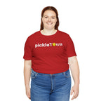 Toronto PickleTOwn T-Shirt featuring CN Tower and Pickleball 'O' logo, stylish casual tee from Printify.