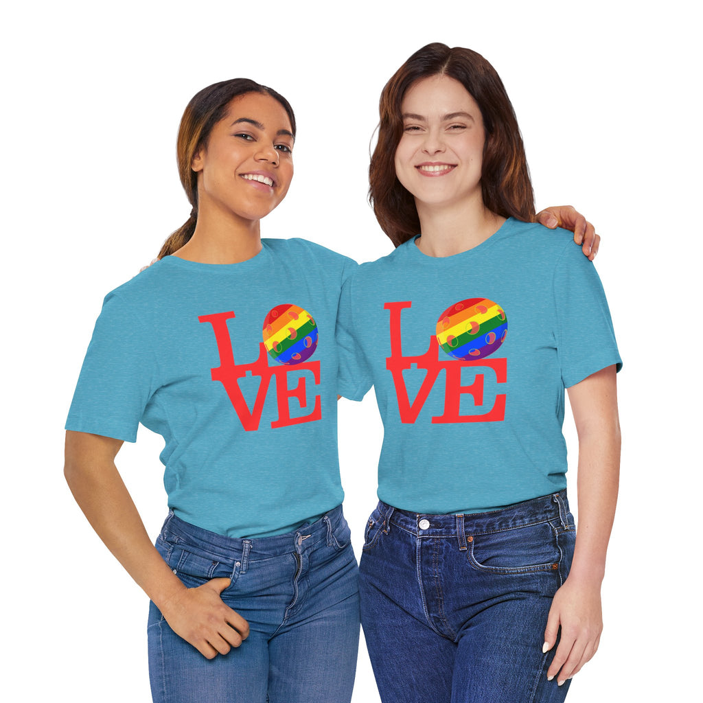 Rainbow LGBTQ+ pride T-shirt featuring the LOVE Pickleball Pride Tee design, made by Printify, showcased on a colorful t-shirt.