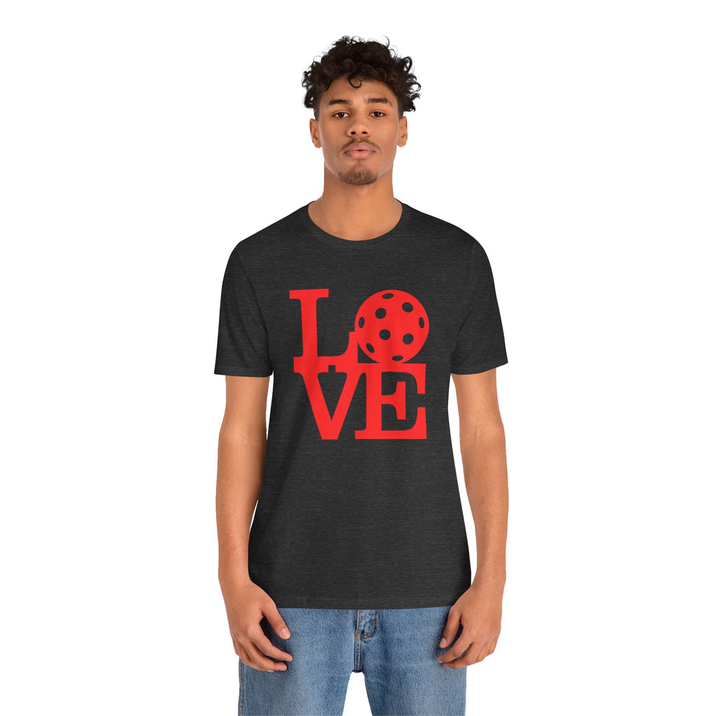Red pop art pickleball T-shirt with LOVE graphic, bold design, printed by Printify, casual and vibrant for active wear.