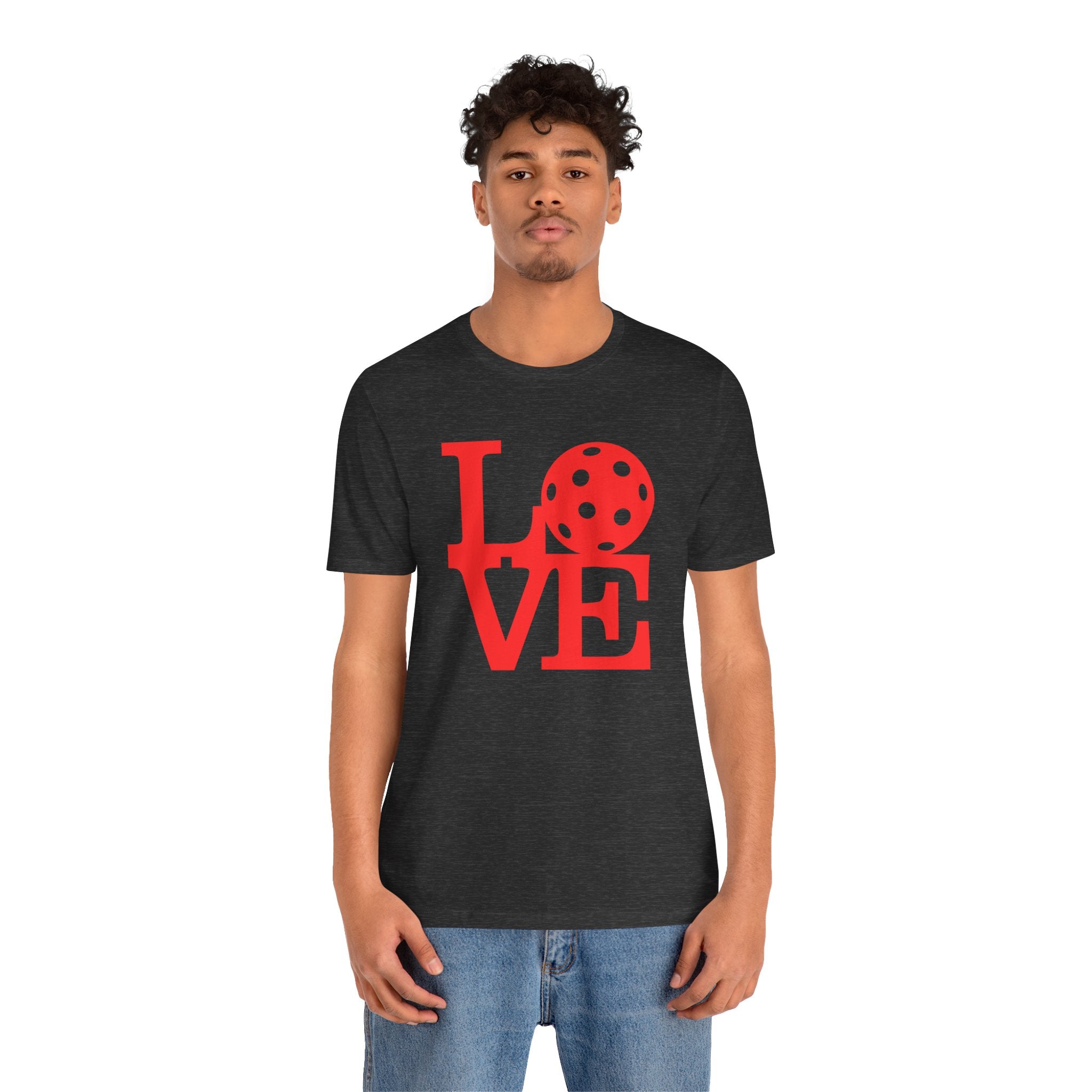 Red pop art pickleball T-shirt with LOVE graphic, bold design, printed by Printify, casual and vibrant for active wear.