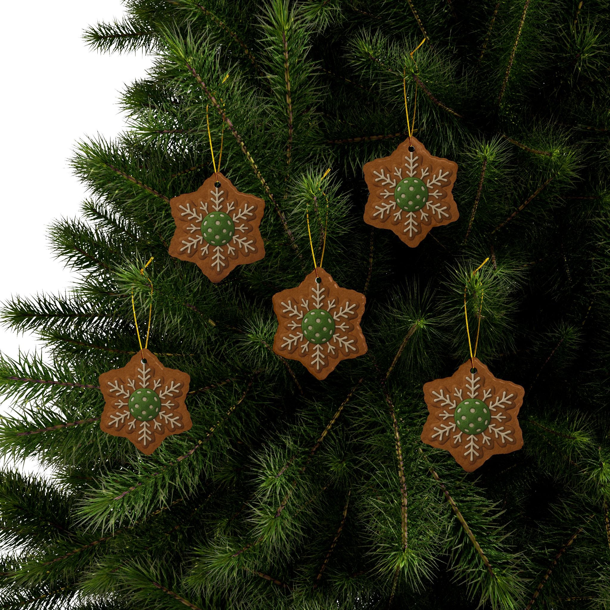 Set of four pickleball-themed Christmas ornaments featuring gingerbread style shapes, festive holiday decor for home or gift.