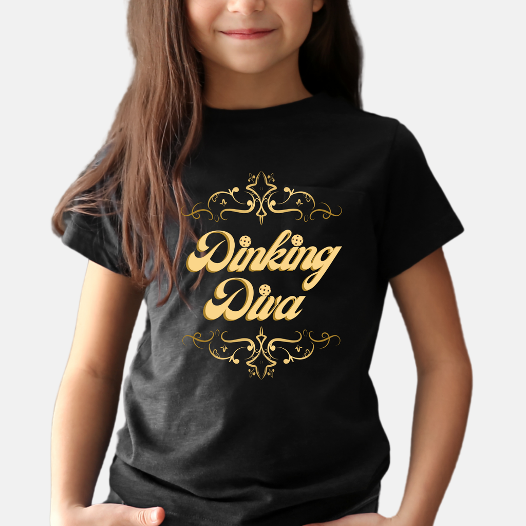 Kids' Youth Dinking Diva T-Shirt by Printify featuring a gold filigree pickleball graphic on a kids' clothing tee.