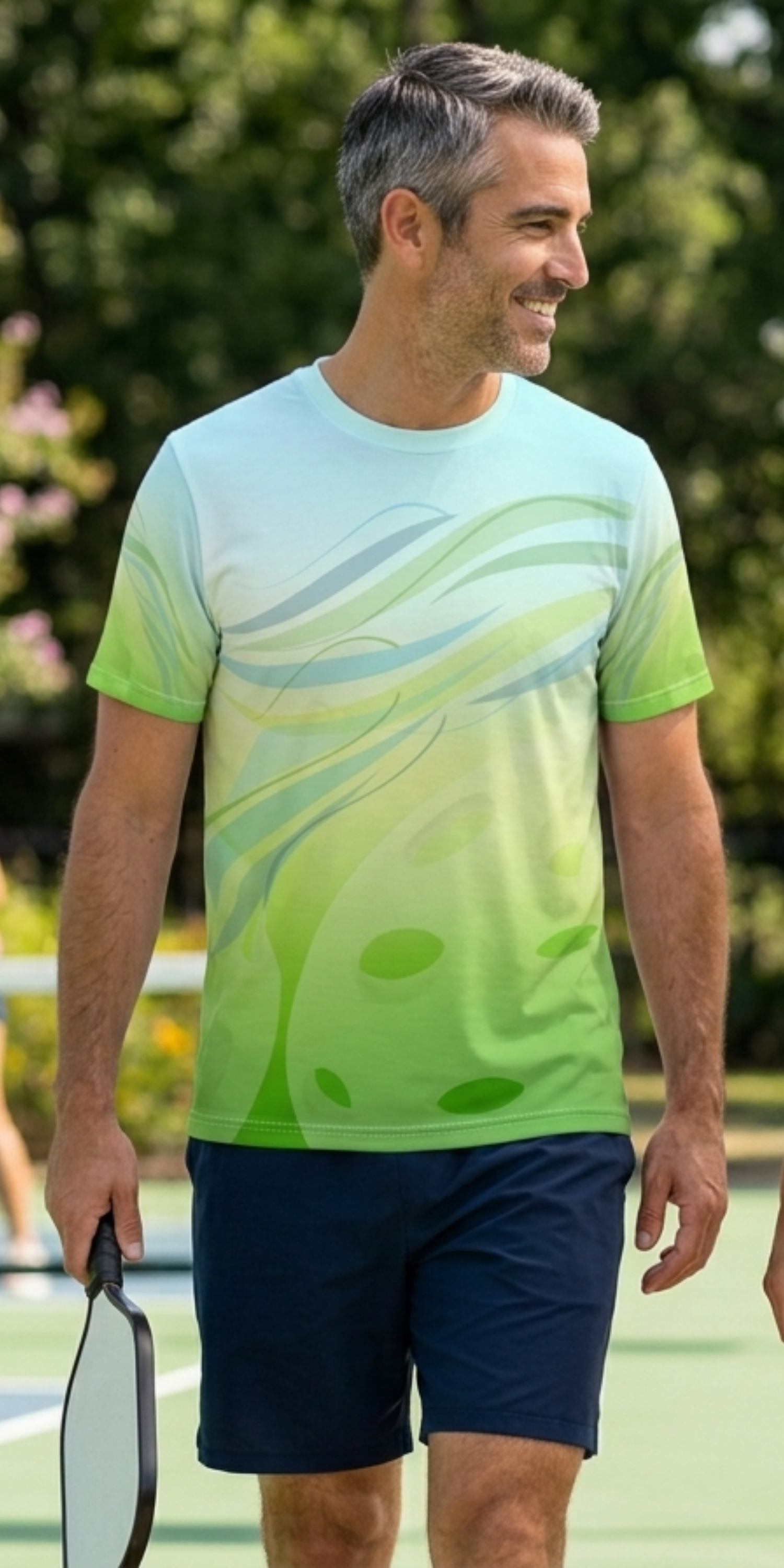 Unisex Pickleball Summer Breeze Tee with green leaf wave all-over print, moisture-wicking fabric from Printify