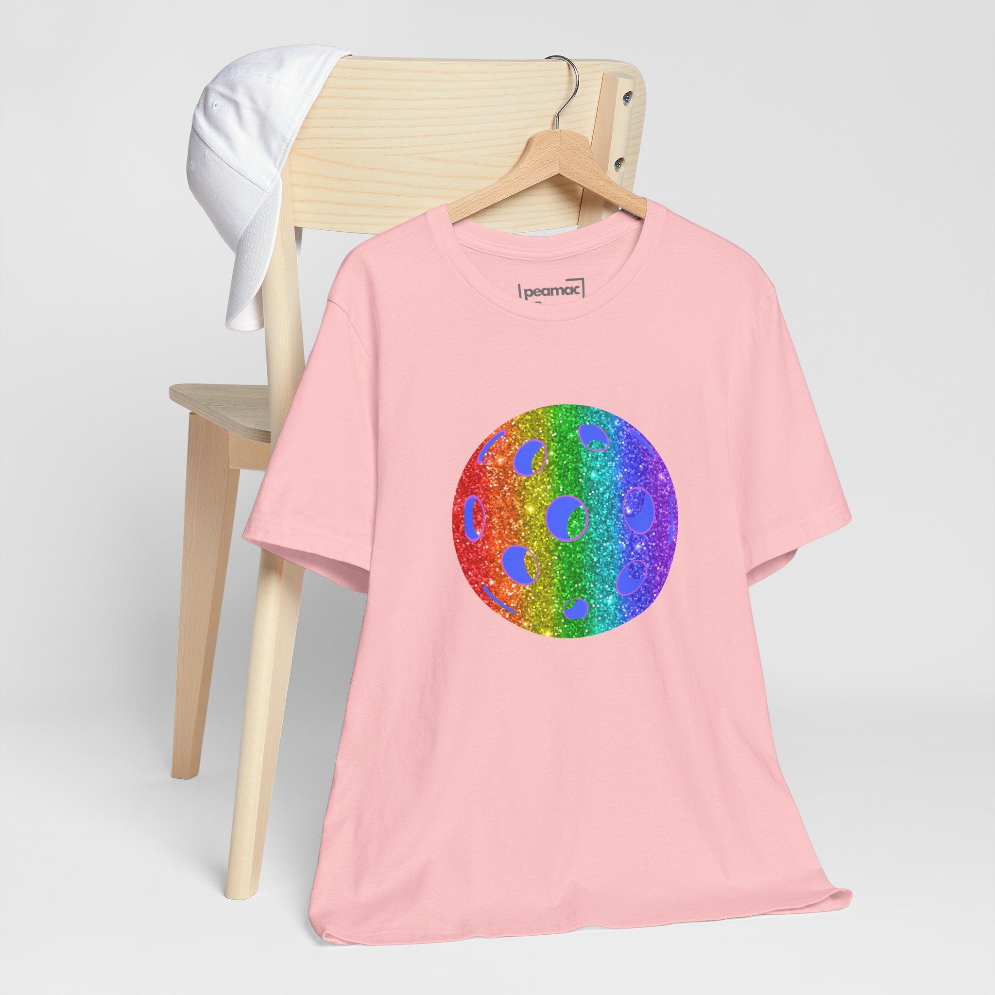 Rainbow glitter pickleball pride T-shirt featuring bold "Loud and Proud" print, designed for LGBTQ+ support and active wear.