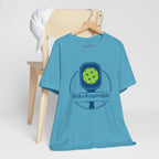 Dinks Responsibly Pickleball T-shirt with paddle and ball graphic, fun pickleball shirt by Printify featuring humorous design.