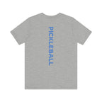 Men's Retro Pickleball Action T-Shirt with dynamic front silhouette and vertical "PICKLEBALL" text on the back, by Printify.