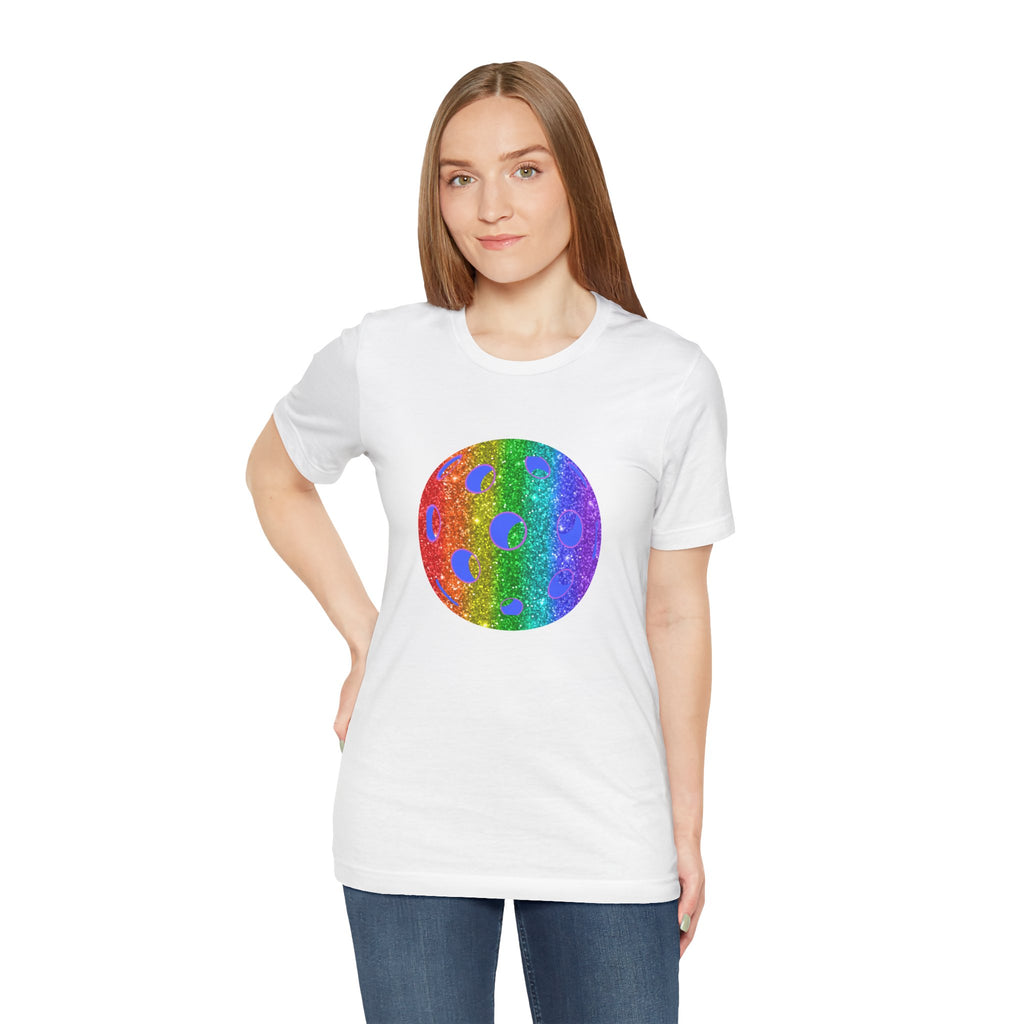 Rainbow glitter pickleball pride T-shirt with "Sparkle Loud and Proud" slogan, featuring colorful pickleball graphics on a white shirt.