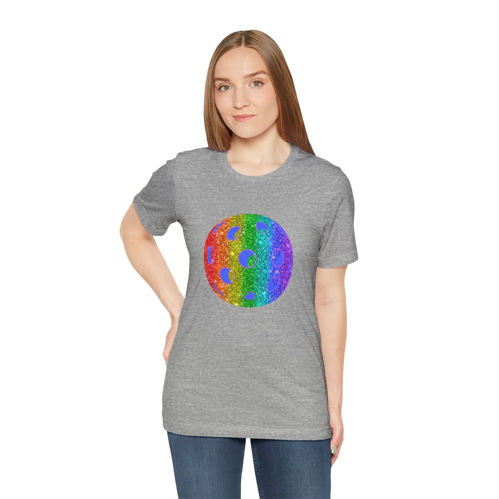 Rainbow glitter pickleball pride T-shirt from Printify with "Sparkle Loud and Proud" slogan, featuring colorful pickleball graphics.