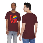 Rainbow LGBTQ2 Pride T-Shirt featuring the LOVE Pickleball logo, colorful design on a comfortable Printify T-shirt
