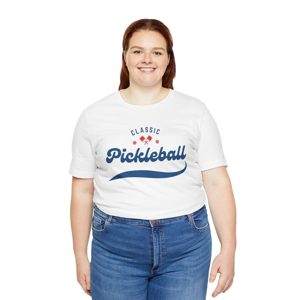 Red and blue pickleball T-shirt with script logo and paddle and ball graphic, casual printify design for pickleball players.