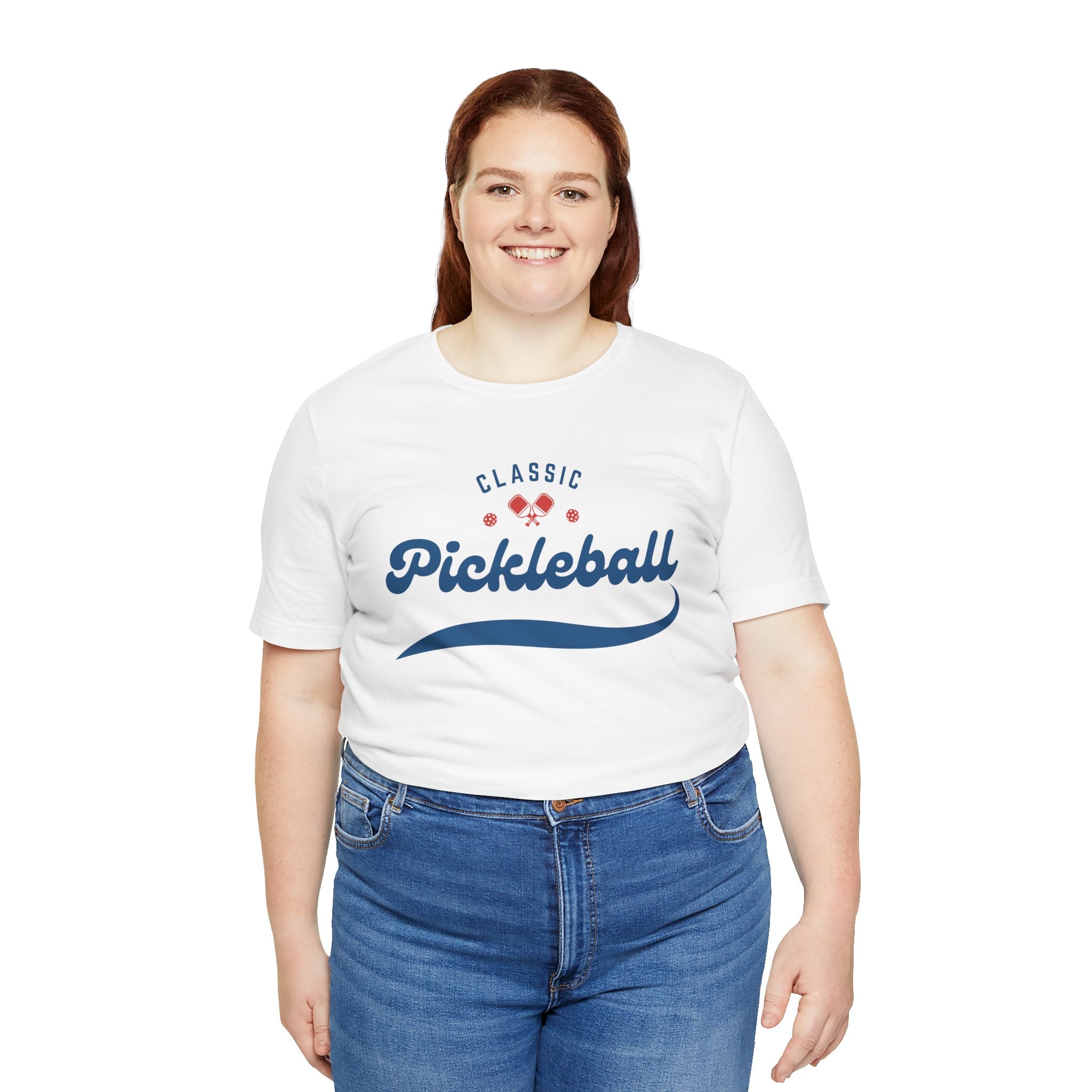 Red and blue pickleball T-shirt with script logo and paddle and ball graphic, casual printify design for pickleball players.