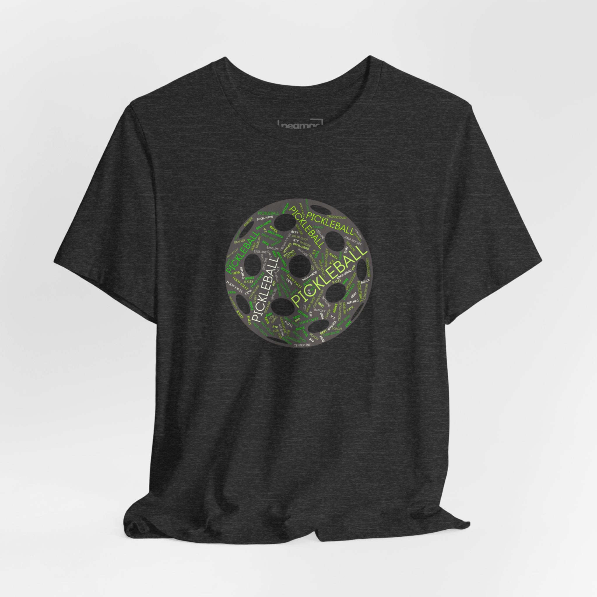 Pickleball Word Cloud T-Shirt with pickleball-shaped graphic, featuring words like dink, pickle, and kitchen on a comfortable printed tee.