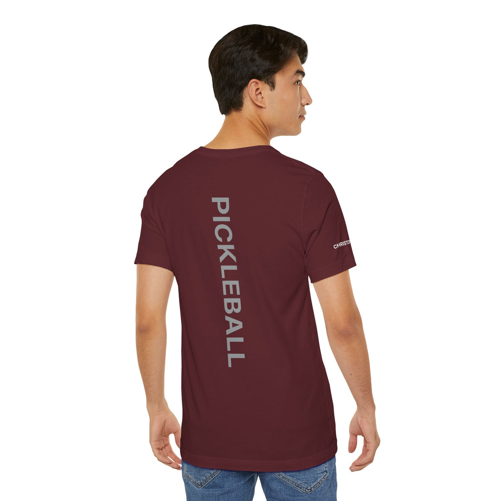 Personalized pickleball T-shirt with custom name sleeve, club logo, and pickleball graphic on the center back by Printify.