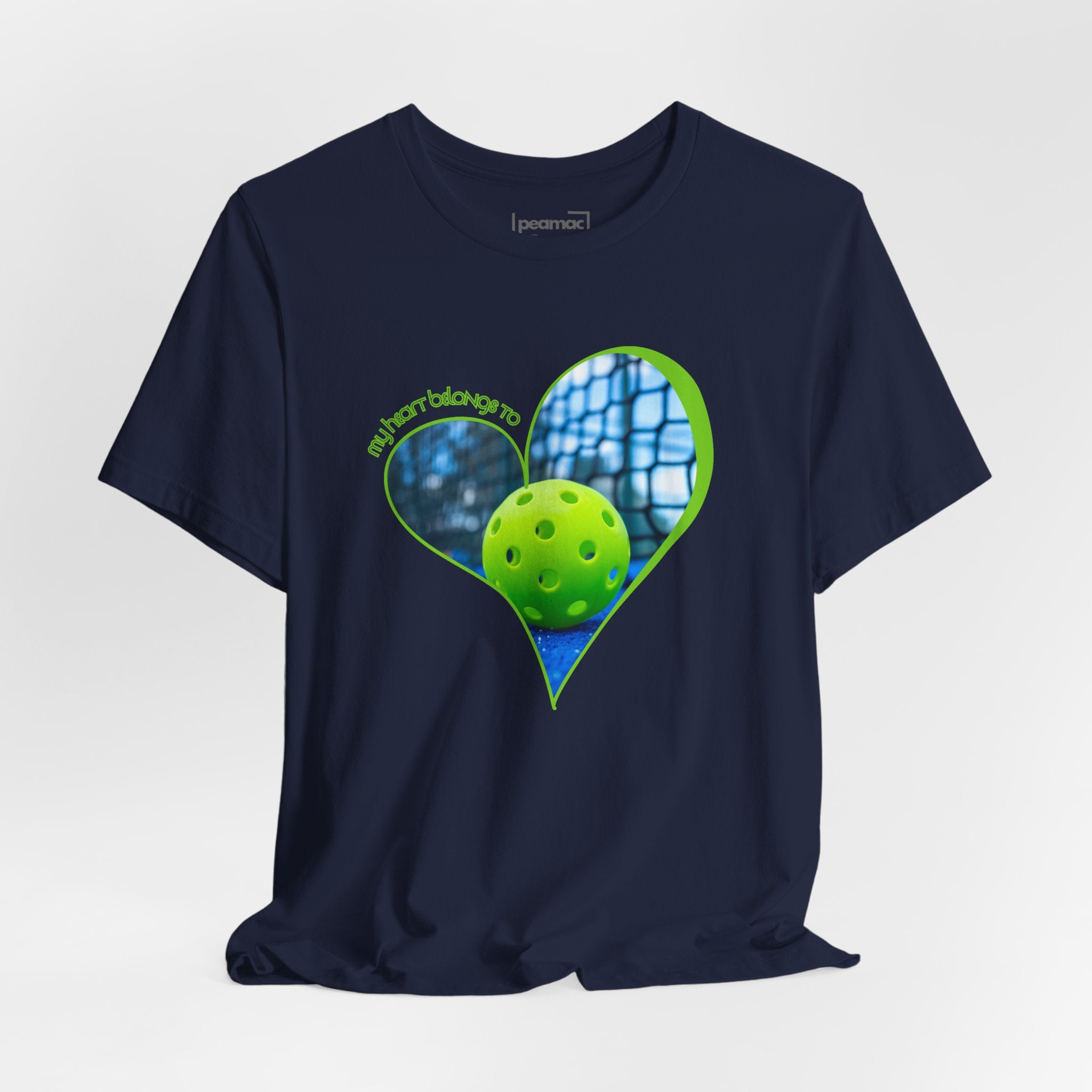 White pickleball T-shirt with "My Heart Belongs to Pickleball" slogan, featuring a sporty design for players and fans.