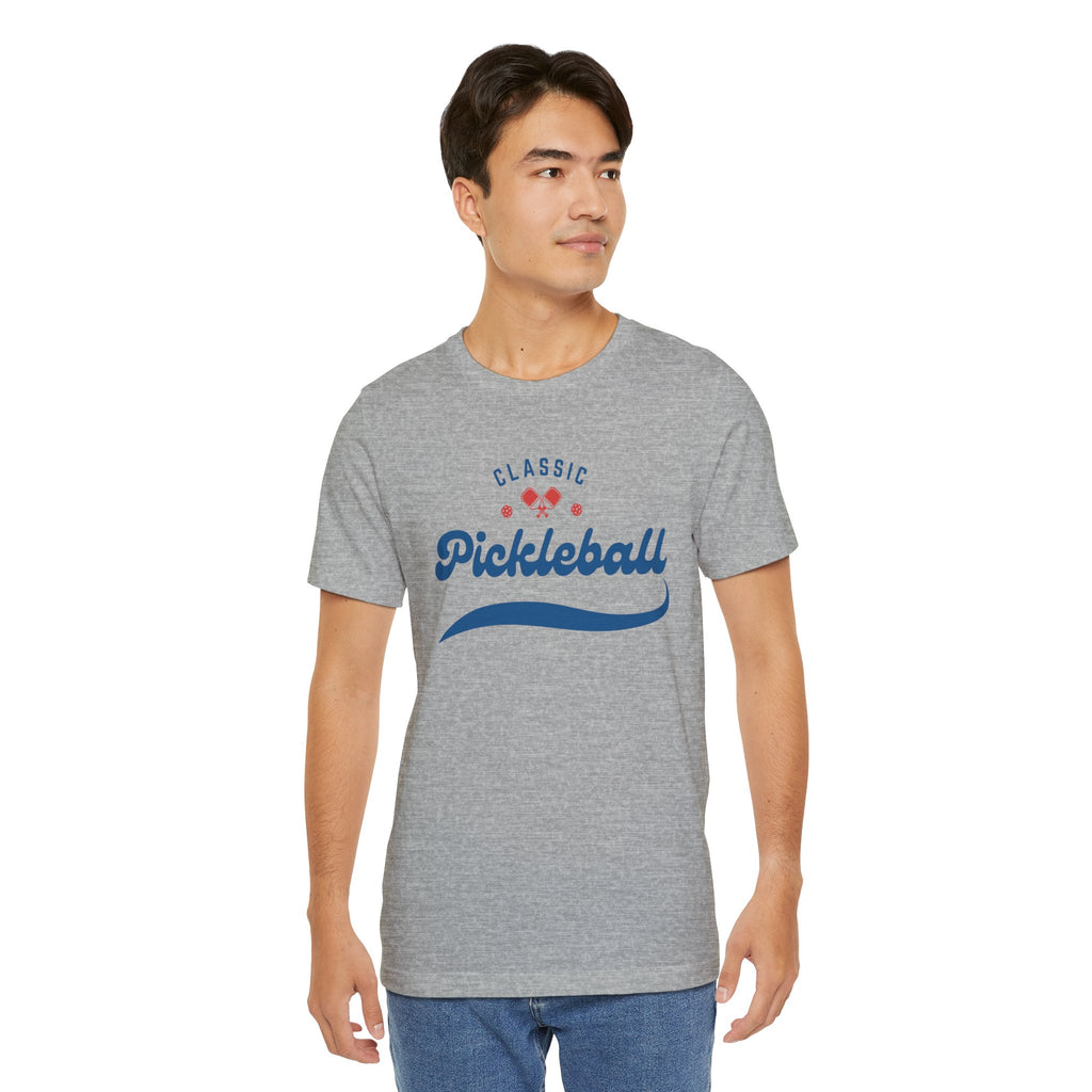 Red and blue pickleball script T-shirt featuring paddle and ball design by Printify, casual athletic wear for pickleball enthusiasts.