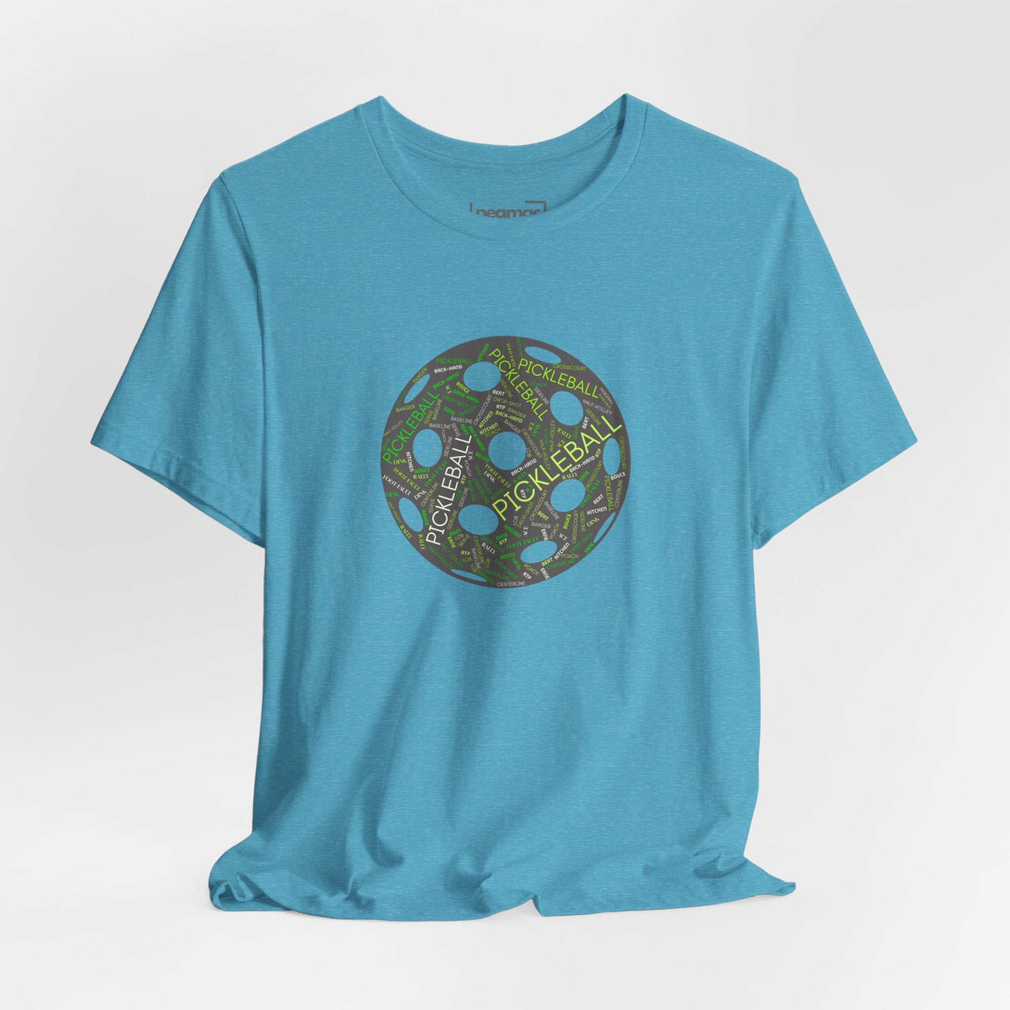 Pickleball Word Cloud T-Shirt with pickleball-shaped graphic featuring dink, pickle, and kitchen terms on a casual tee.