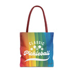 Colorful rainbow tote bag featuring crossed pickleball paddles and script design, ideal for carrying sports gear and everyday essentials.
