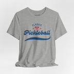 Red and blue pickleball script tee featuring paddle and ball design, comfortable cotton T-shirt by Printify