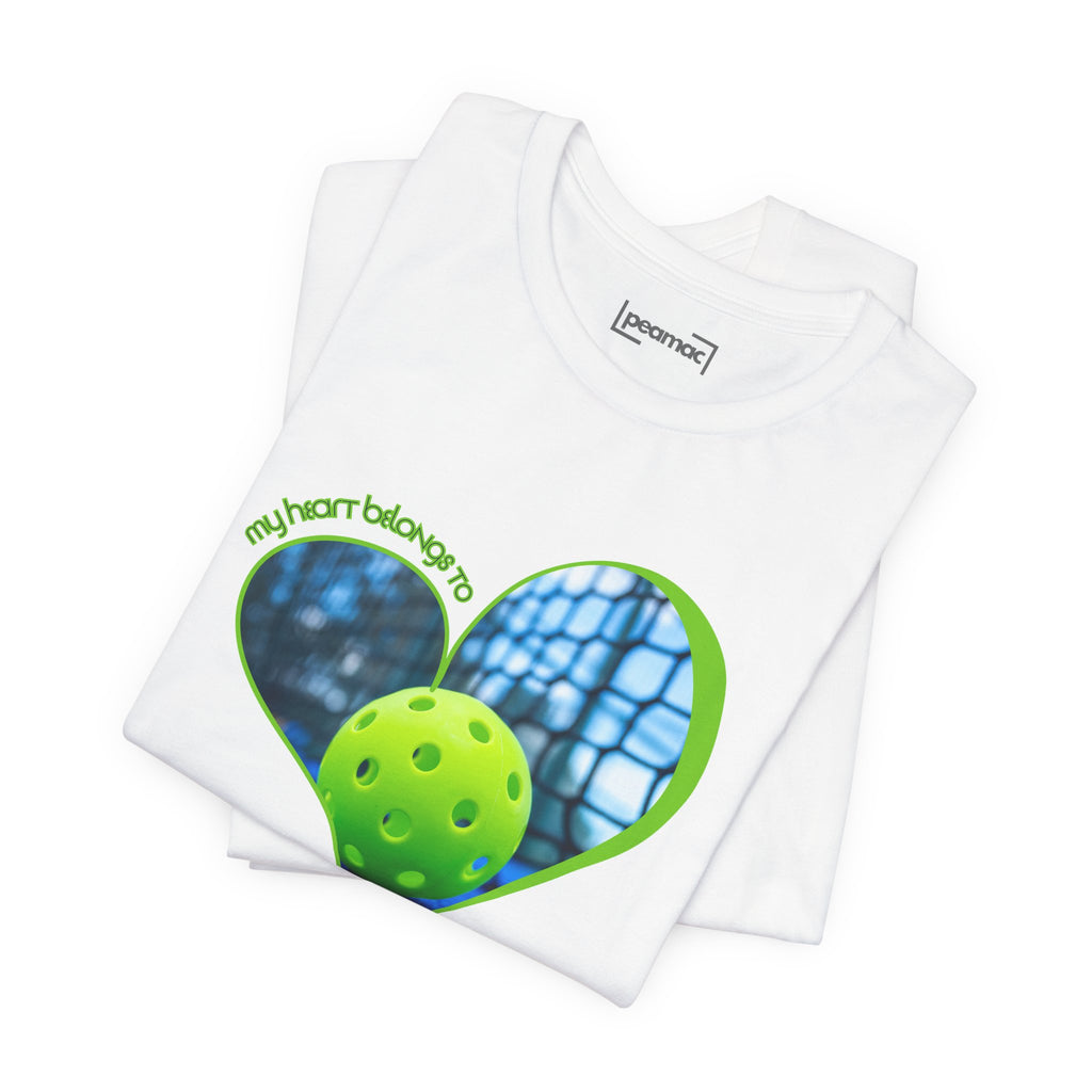 White pickleball T-shirt with "My Heart Belongs to Pickleball" slogan, ideal for players and fans, by Printify.