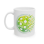 Green ceramic mug featuring a pixelated pickleball design with retro exploding graphic, available in 11oz and 15oz sizes.