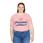 Red and blue pickleball script T-shirt featuring paddle and ball design, casual cotton tee by Printify.