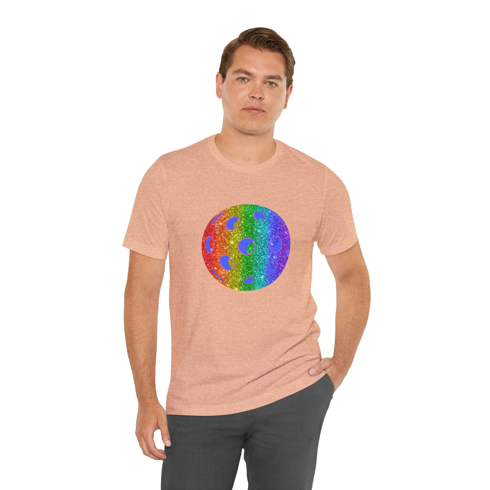 Rainbow glitter pickleball T-shirt featuring "Loud and Proud" slogan, designed for pride and sportswear by Printify.