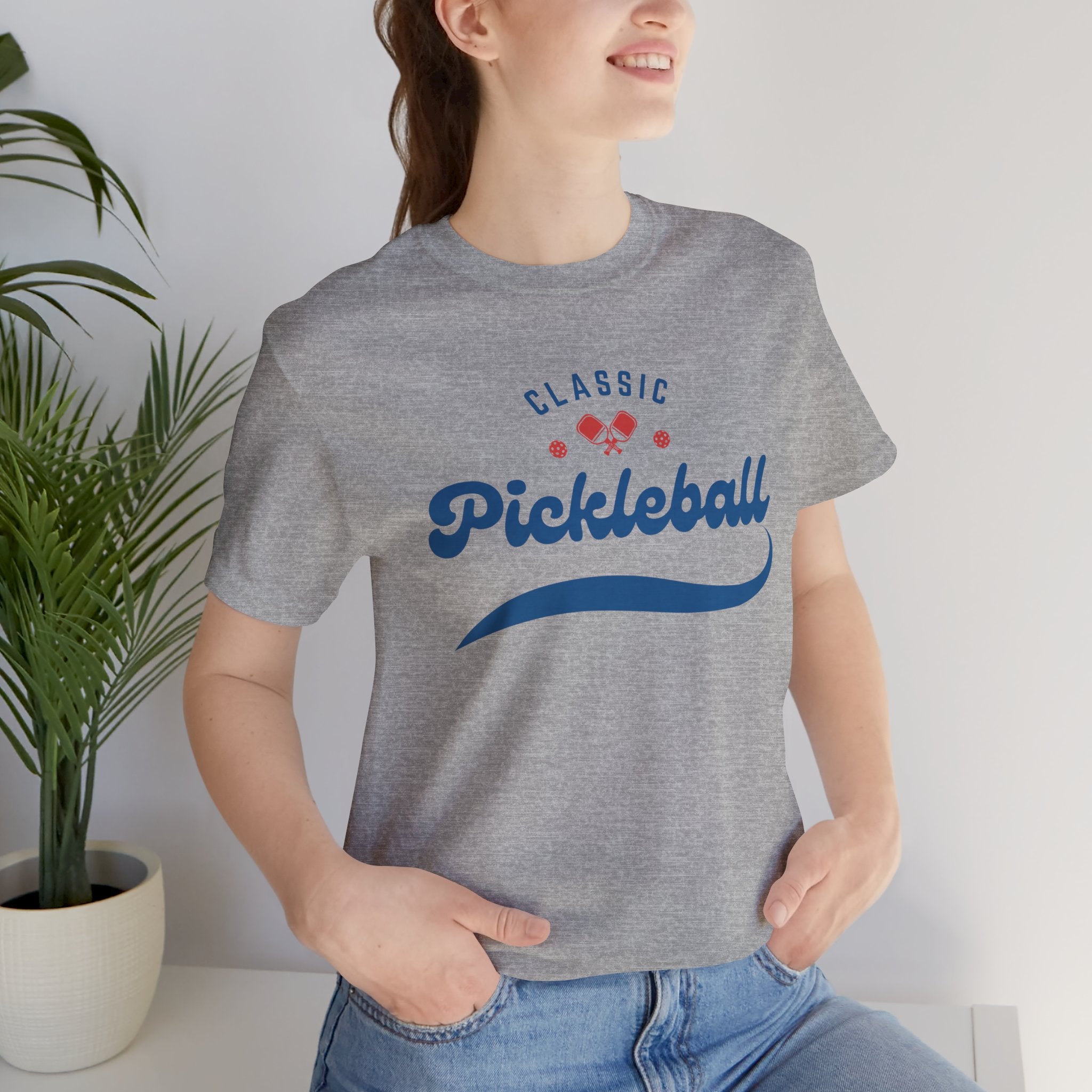 Red and blue pickleball script T-shirt featuring paddle and ball design, casual printify branded cotton tee for pickleball enthusiasts