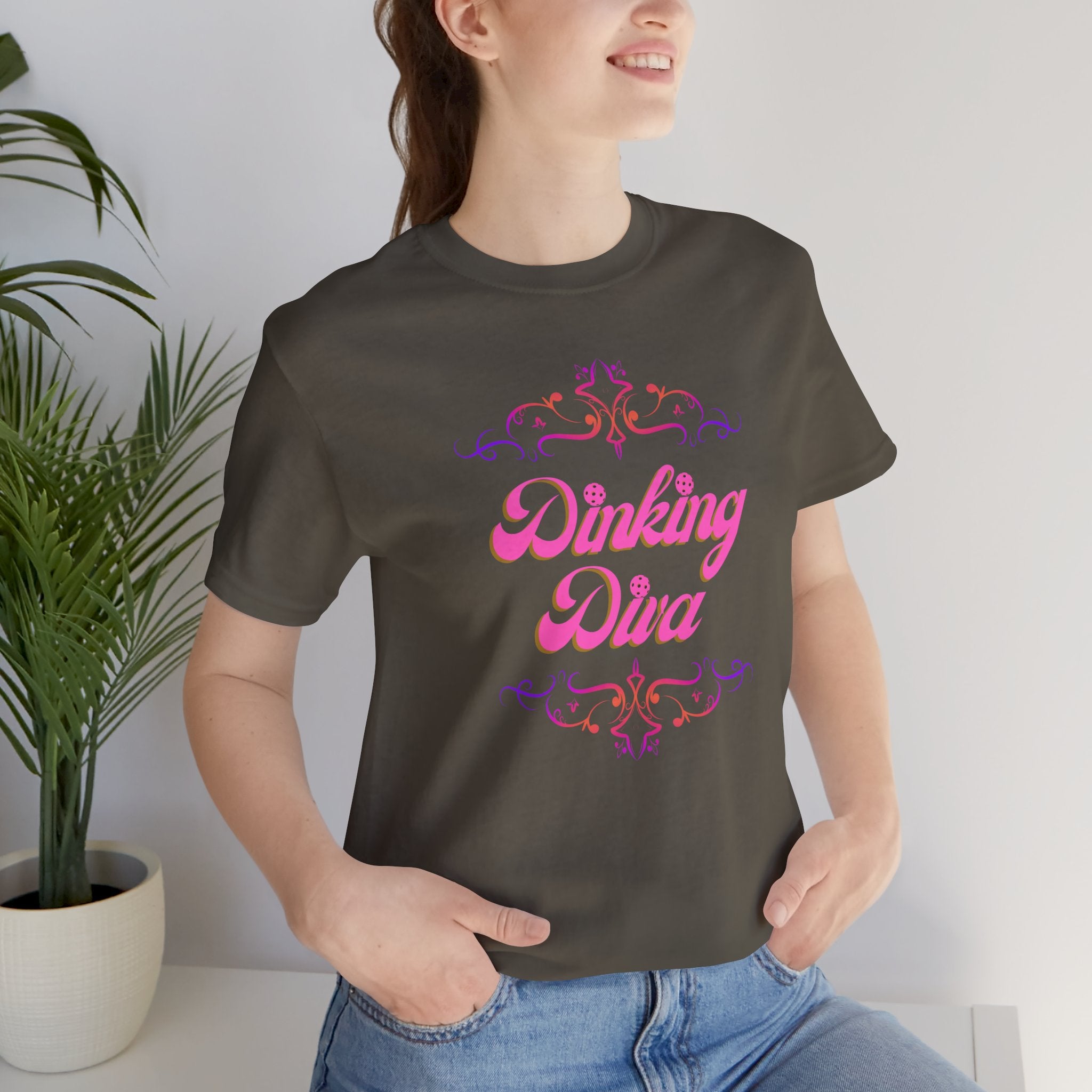 Pink Dinking Diva Pickleball T-Shirt with filigree design, athletic fit, and casual style by Printify.