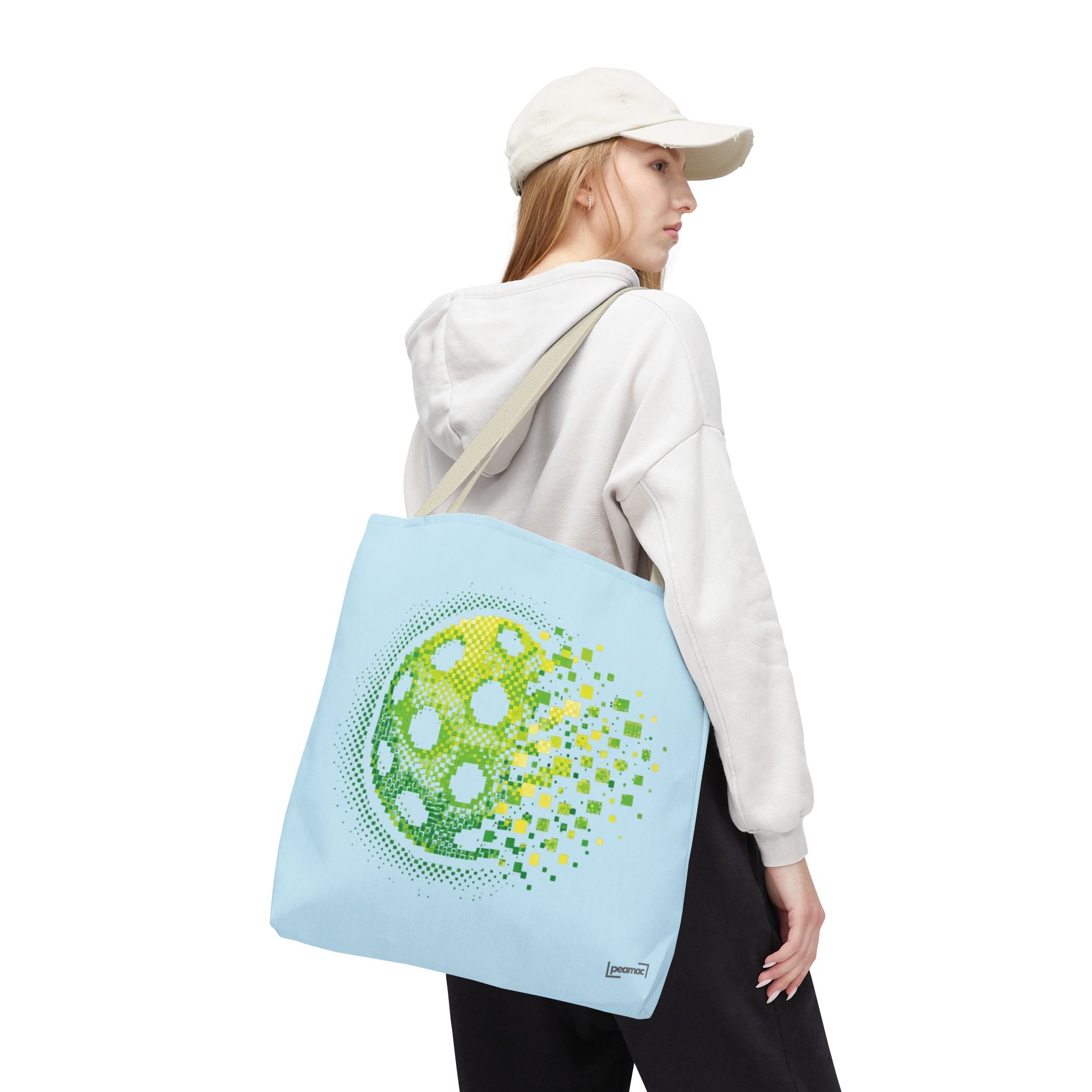 Pixelated pickleball tote bag in green, yellow, and light blue with digital smash design, 18x18 inches, by Printify.
