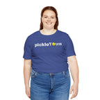 Toronto PickleTOwn T-Shirt featuring the CN Tower and pickleball design, stylish casual tee by Printify.