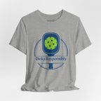 Dinks Responsibly Pickleball T-shirt with paddle and ball graphic, fun pickleball shirt by Printify.