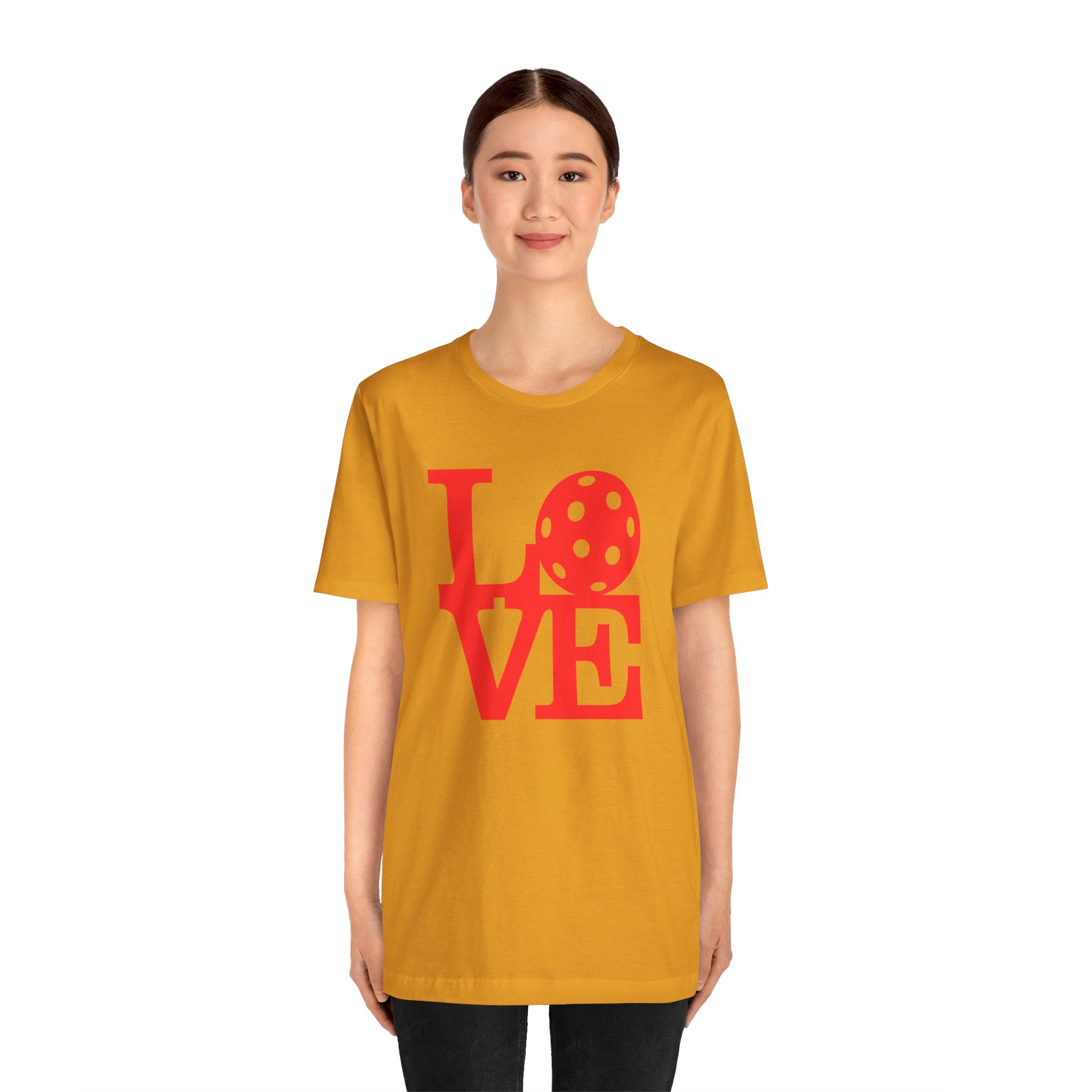 Red LOVE Pickleball graphic T-shirt by Printify featuring bold pop art design, casual fit, perfect for pickleball enthusiasts.