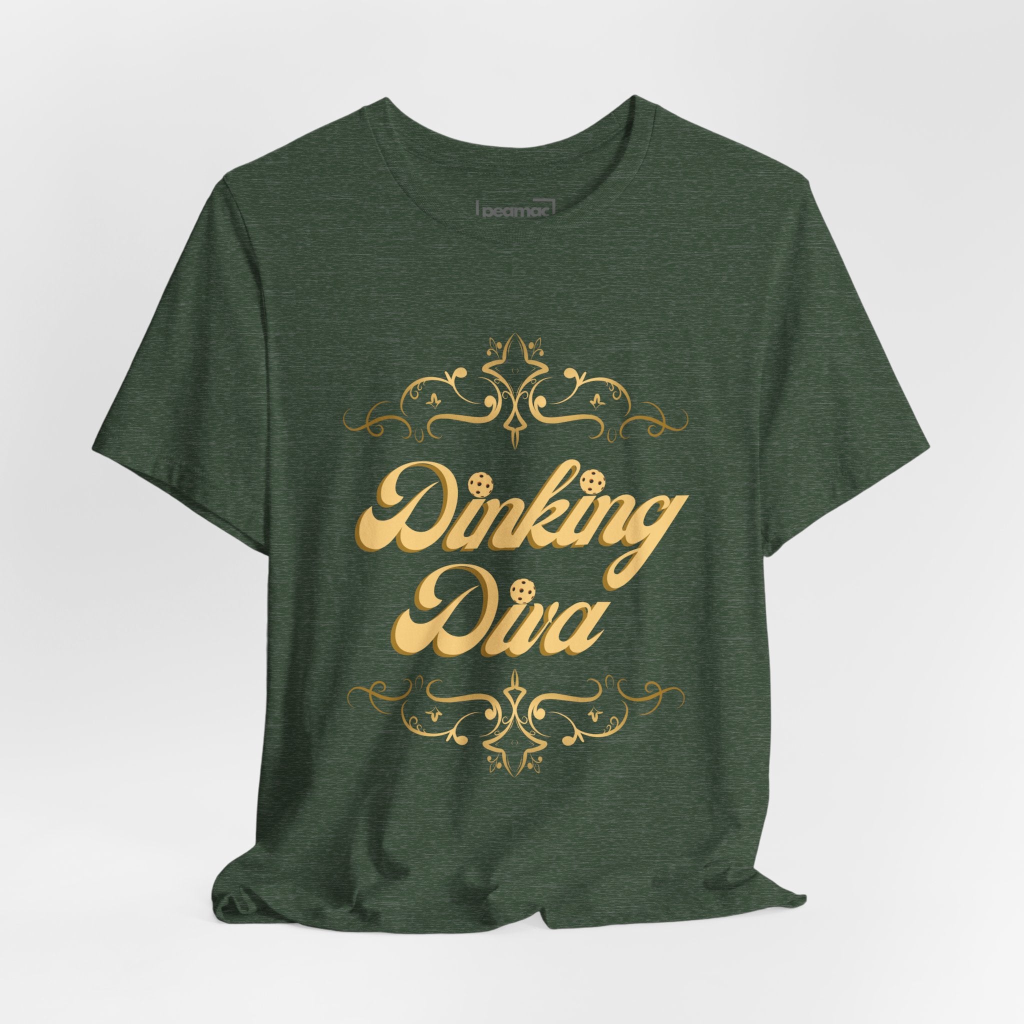 Dinking Diva pickleball T-shirt in gold filigree design, casual fit, with Dinking Diva logo on front, ideal for pickleball players.