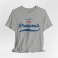 Red and blue pickleball script T-shirt with paddle and ball design, casual printify brand tee for pickleball enthusiasts