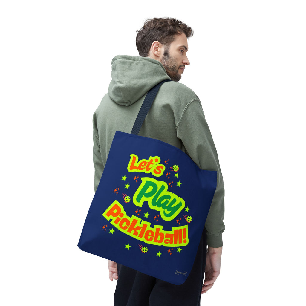Large navy Printify Let's Play Pickleball tote bag with shoulder strap, designed for carrying pickleball equipment and accessories.