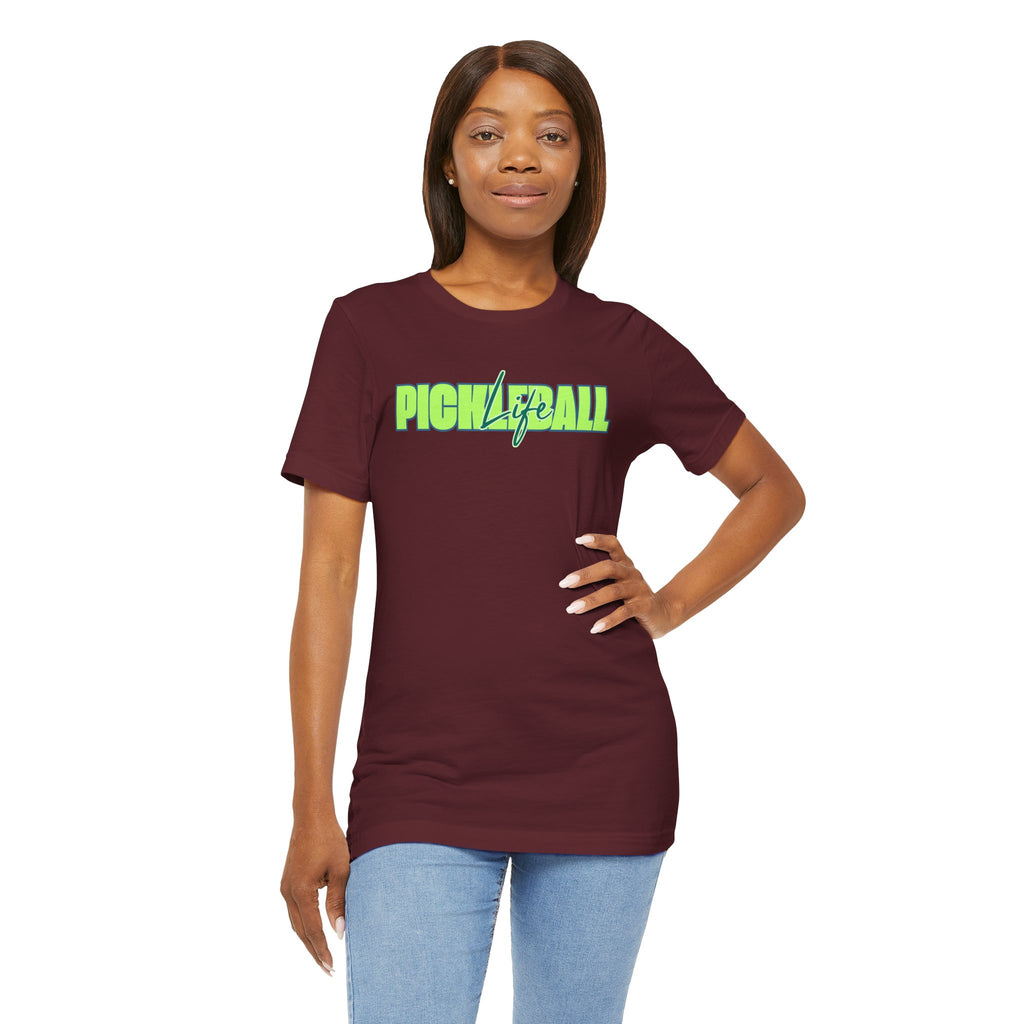 Unisex pickleball T-shirt by Printify with bold green and blue graphic design on soft fabric.