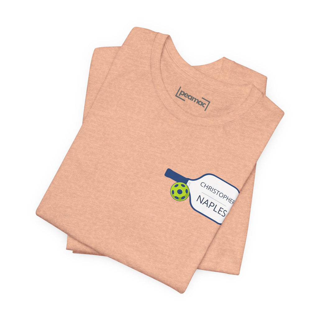 Personalized pickleball T-shirt with custom name and club text, featuring a paddle graphic design by Printify.