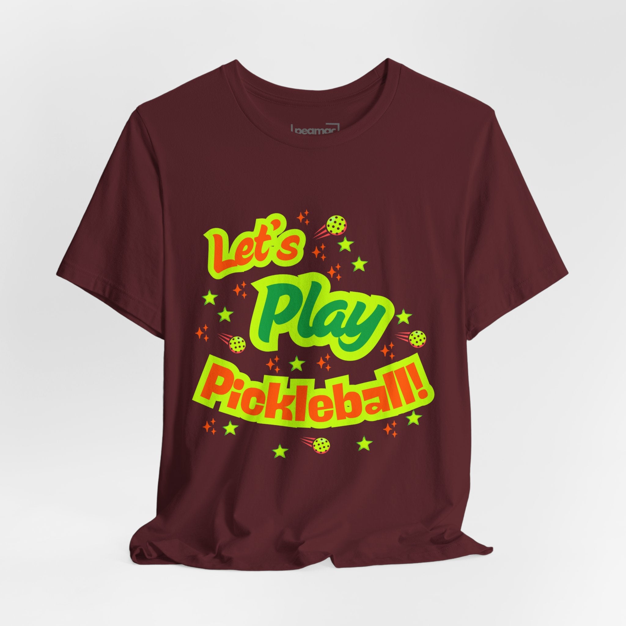 Neon orange and electric green pickleball rally T-shirt with court graphic, printed by Printify, featuring vibrant sports apparel design.