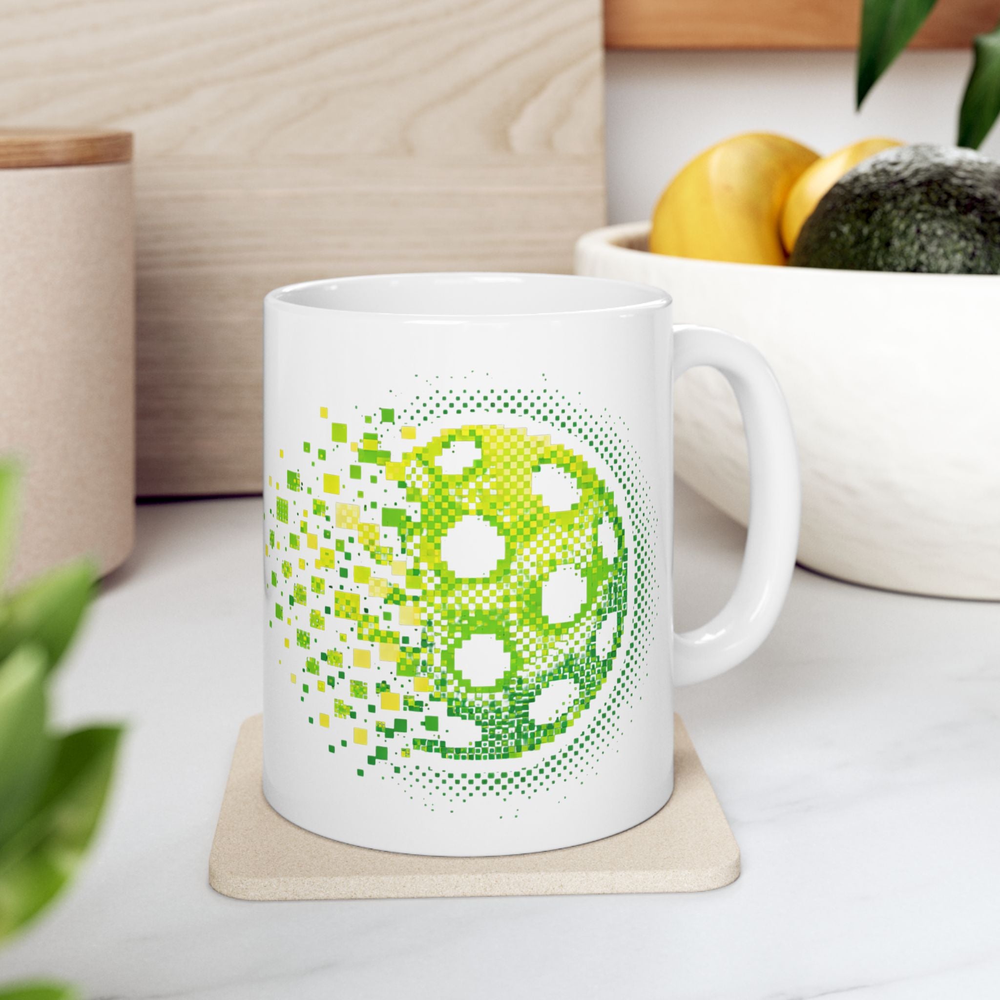 Green ceramic mug with retro pixelated pickleball design, 11oz or 15oz size, featuring an exploding pickleball graphic.