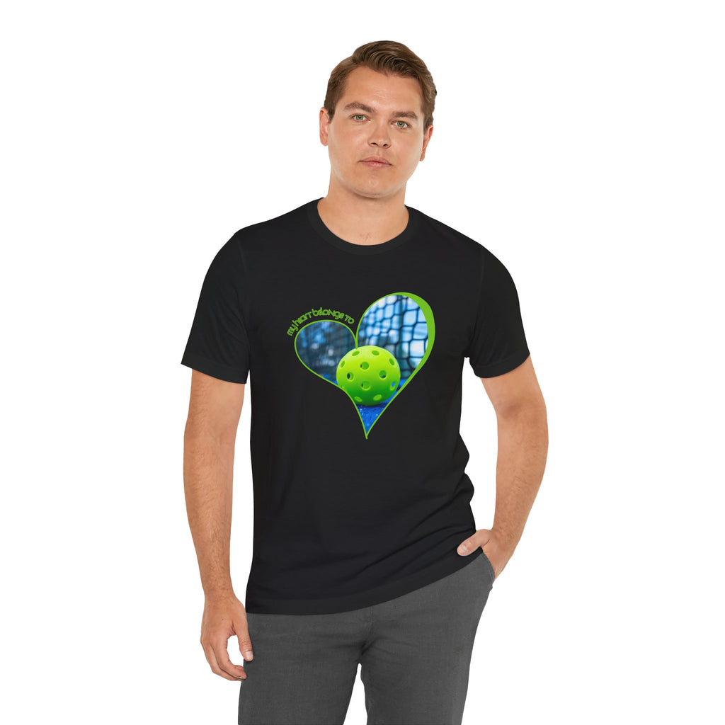White pickleball T-shirt with "My Heart Belongs to Pickleball" slogan, designed for players and fans, by Printify.