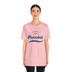 Red and blue pickleball T-shirt featuring paddle and ball design, classic script print, by Printify.