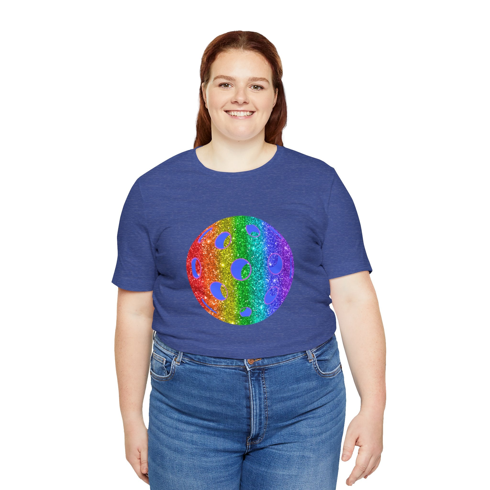 Rainbow glitter pickleball T-shirt with "Sparkle Loud and Proud" slogan, celebrating pride and inclusivity, by Printify.
