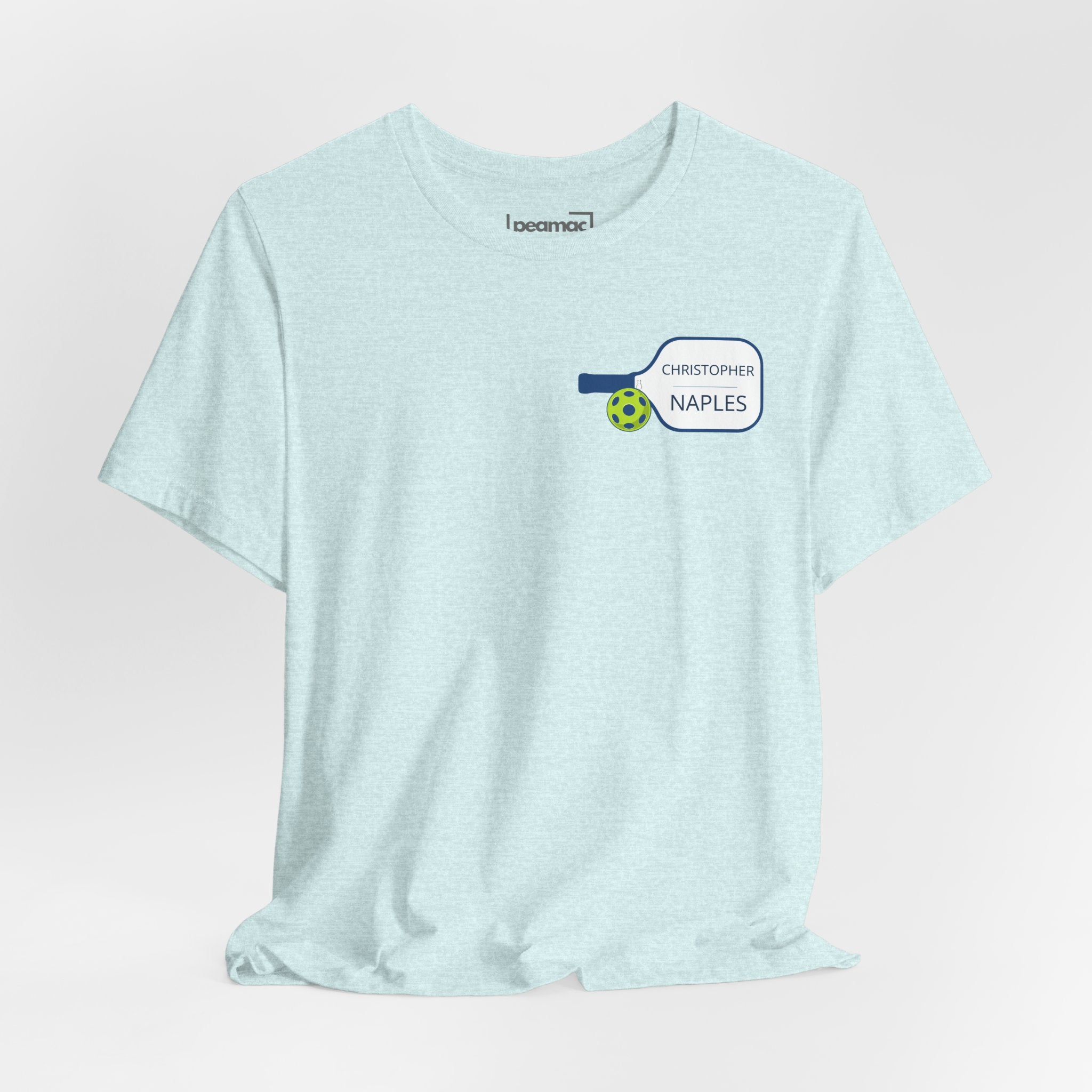 Personalized pickleball T-shirt with custom name and club graphic design, featuring a paddle illustration, by Printify.