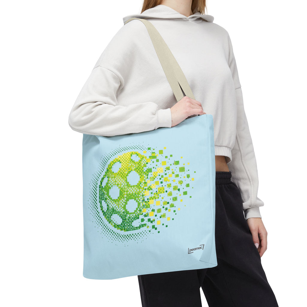 Pixelated pickleball tote bag in green, yellow, and light blue with digital smash design, 18x18 inches, by Printify.