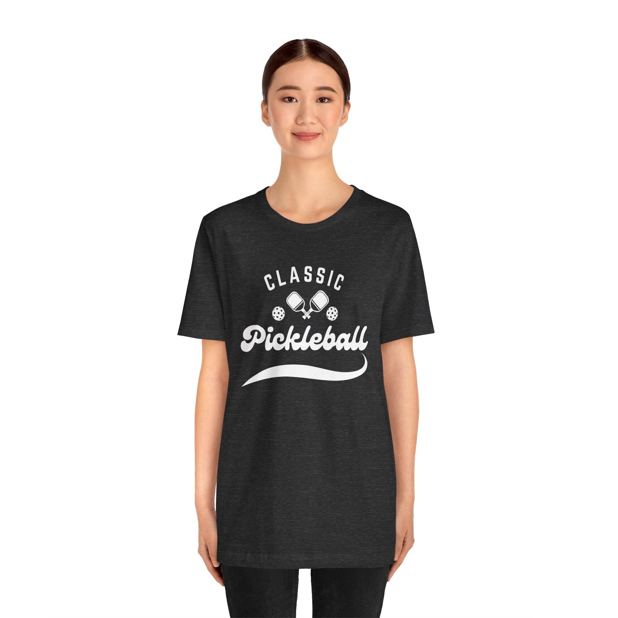 White Classic Pickleball T-shirt with "Pickleball" script design, casual fit, printed by Printify, ideal for pickleball enthusiasts.