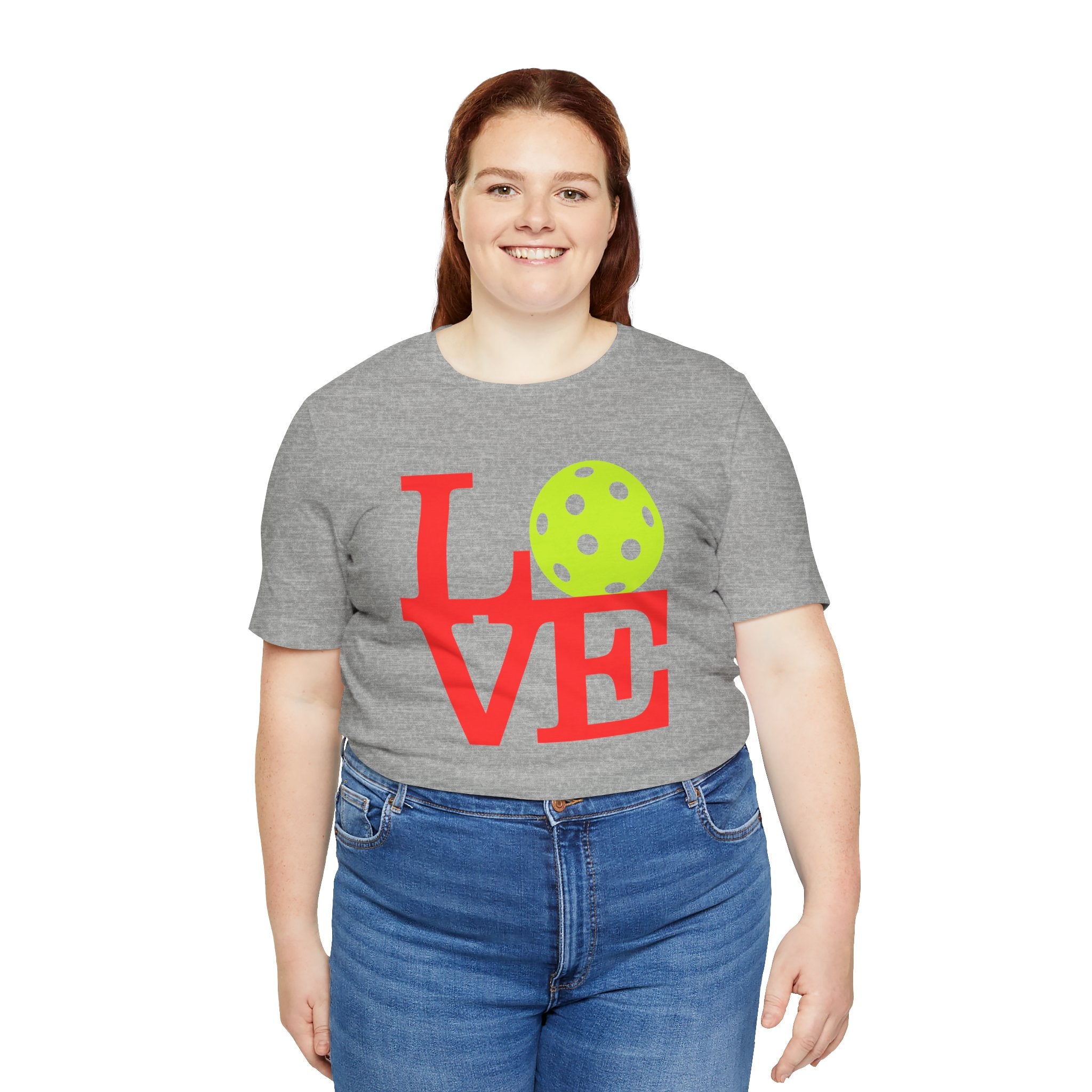 Bright neon pop art pickleball LOVE T-shirt by Printify, featuring bold colorful lettering on a comfortable casual t-shirt.